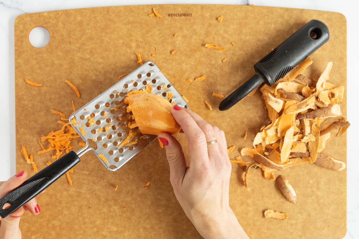 Shredding sweet potato for turkey sweet potato meatballs.
