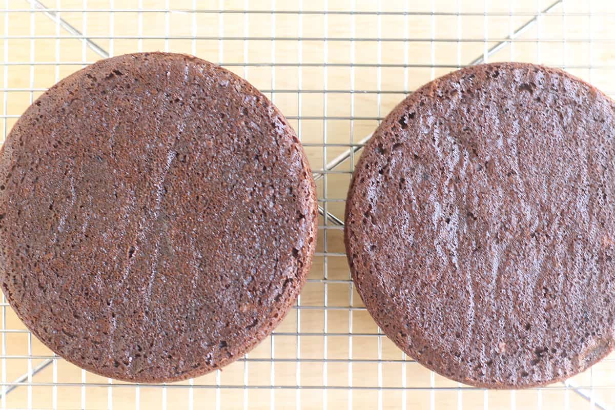 baked healthy chocolate cake cooling on wire rack.