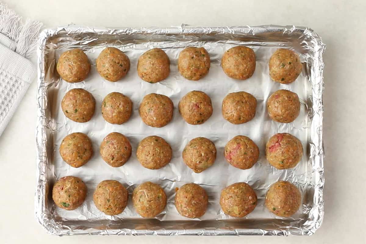 formed healthy meatballs on foil lined pan.