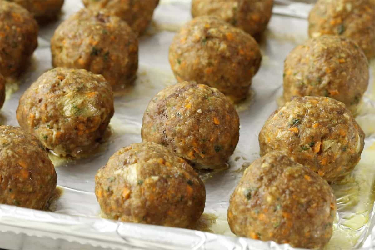 baked toddler meatballs on baking sheet.