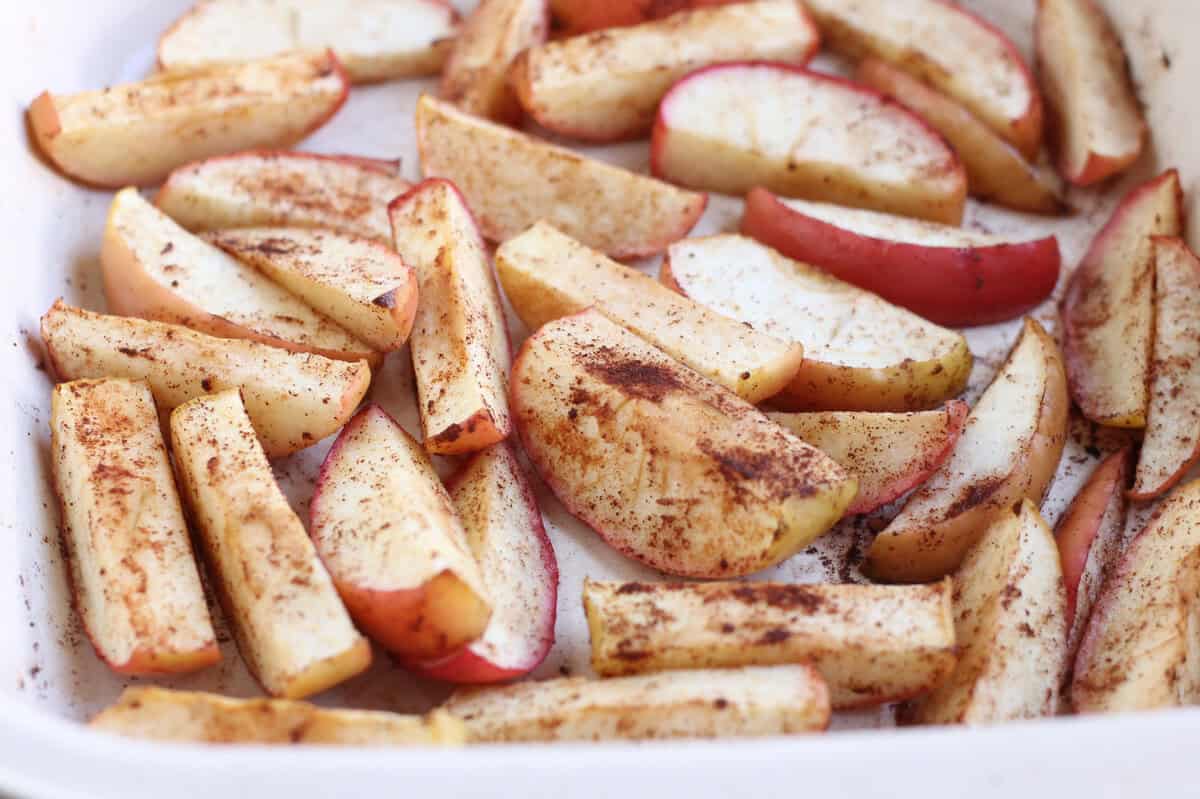 Sliced apples in baking pan before baking.