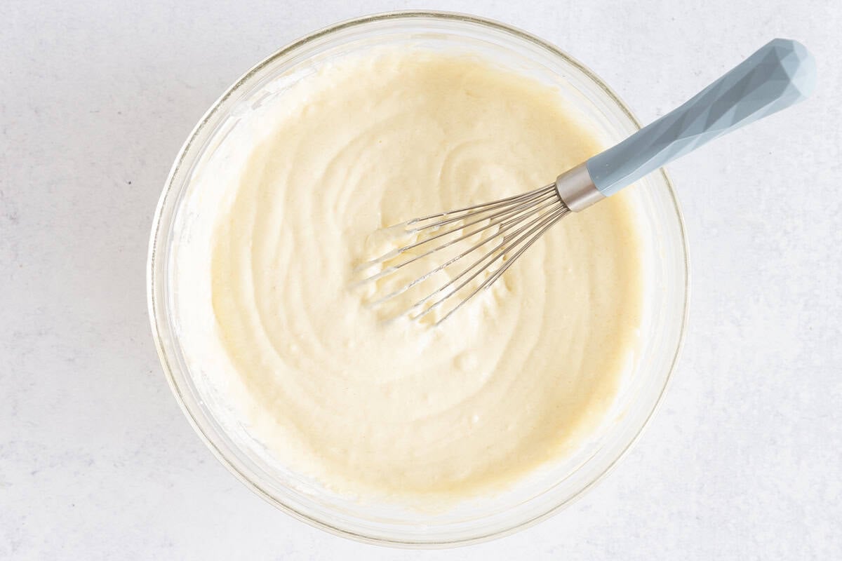 dry ingredients for Greek yogurt pancakes in glass bowl on counter.
