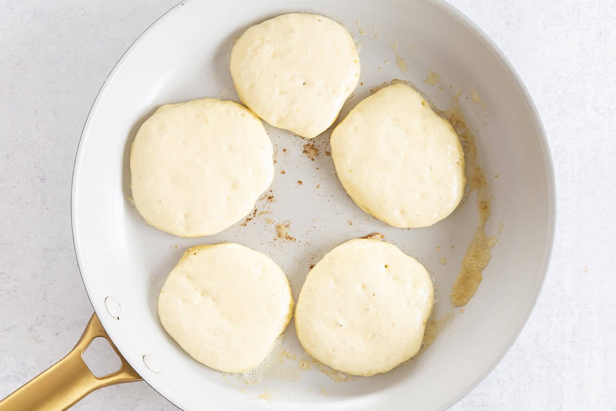 set Greek yogurt pancakes in skillet.