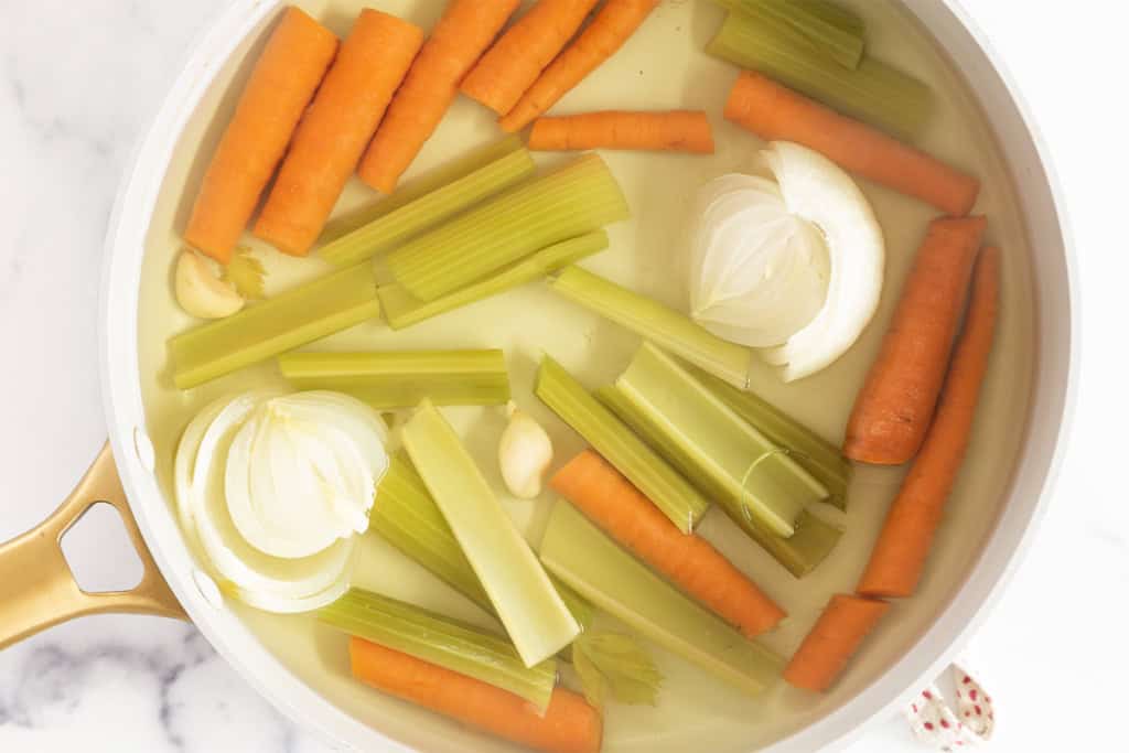 Simmering veggies in water for veggie broth.