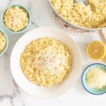 orzo risotto in various bowls and pan with cheese topping.