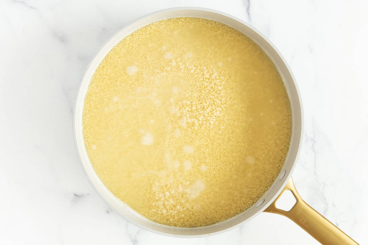 Broth in pot for pastina pasta. 