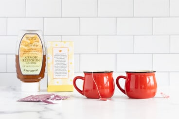 Favorite tea for kids on countertop in two mugs.