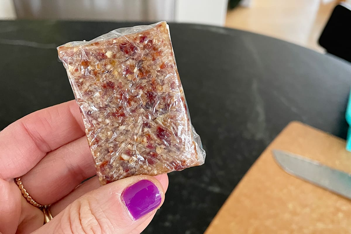 energy bite recipe cut into bars and wrapped in plastic wrap.