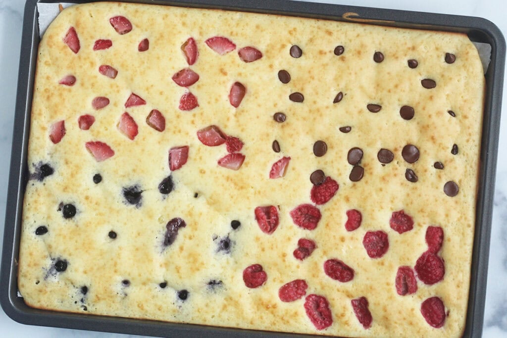 sheet pan yogurt pancake with fruit on top.