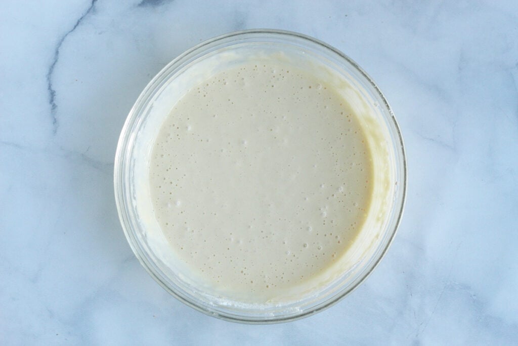 yogurt pancakes batter in glass bowl on counter.