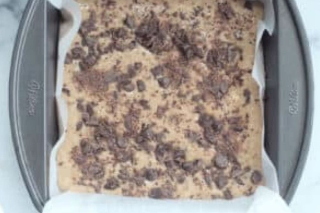 Chocolate chip banana cake in pan before baking.