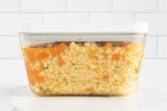 Chicken and stars soup in storage container.