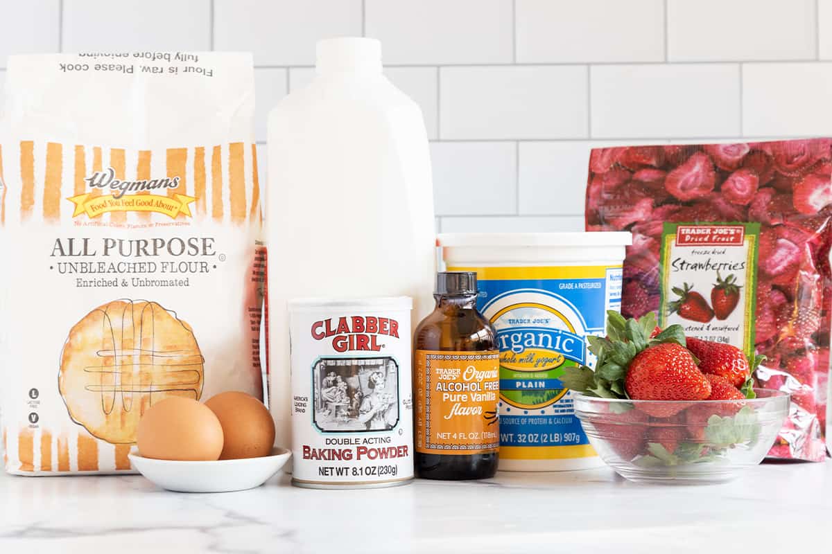 Ingredients for strawberry pancakes on countertop.