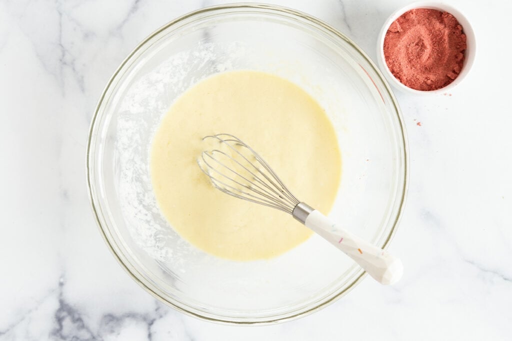 wet ingredients for strawberry pancakes in bowl.