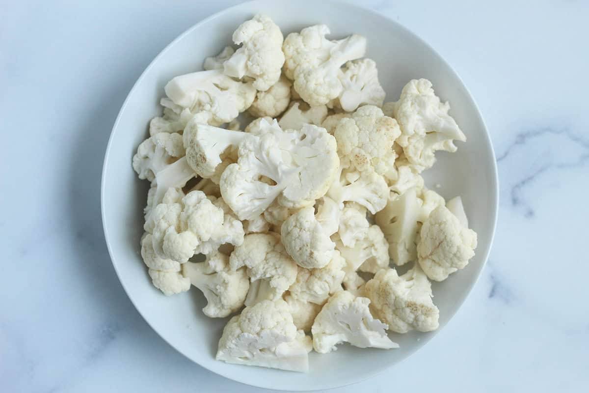 Cauliflower cut into florets for mac and cheese. 
