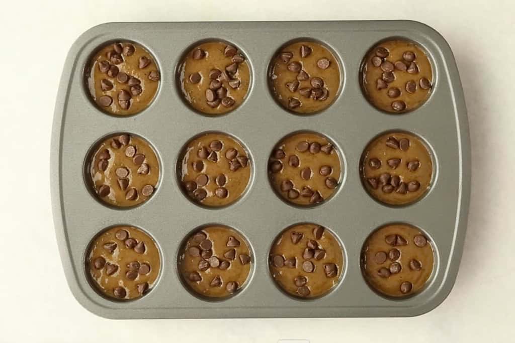 chocolate protein muffin batter in pan.