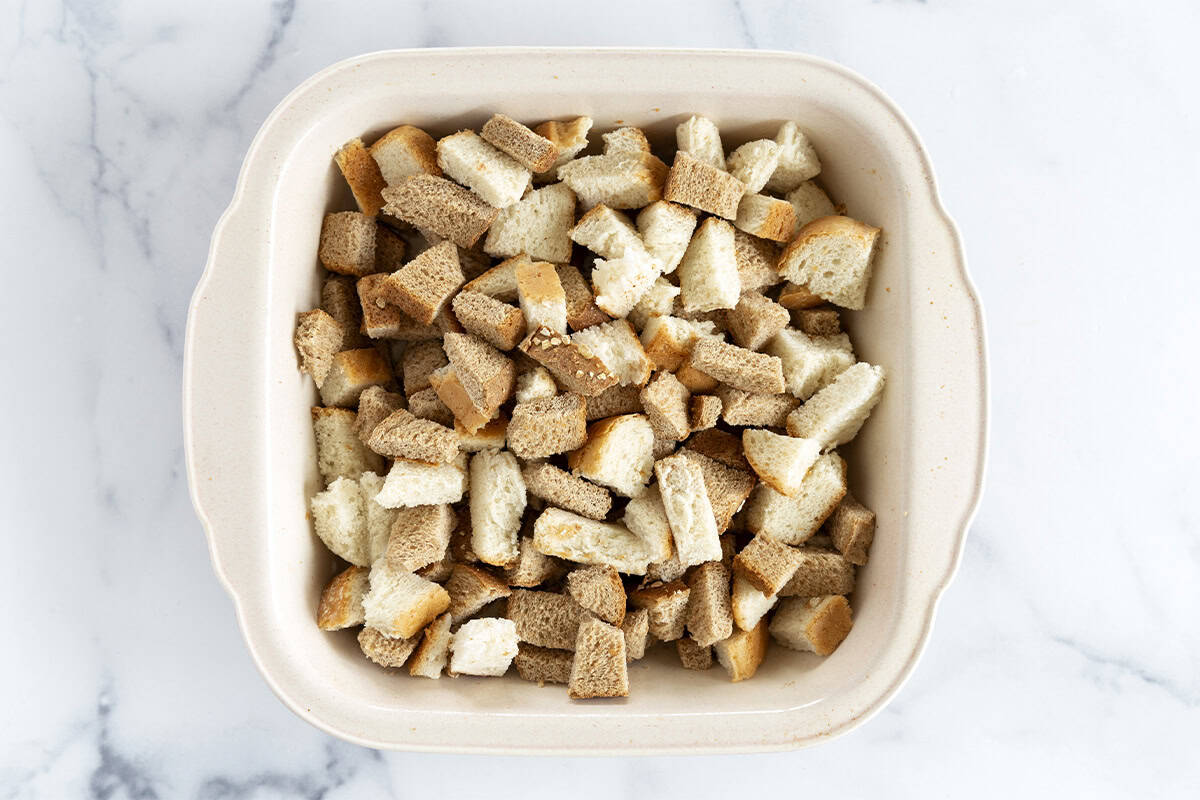 Cubes of bread in baking pan for french toast casserole. 