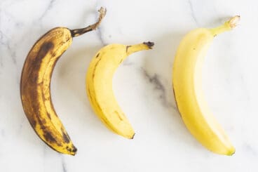 range of ripe bananas on countertop.