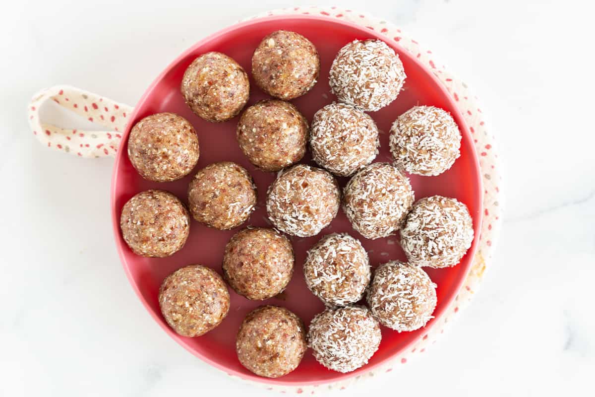 Bliss balls on red plate. 