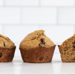 Bran muffins in line with one cut in half.