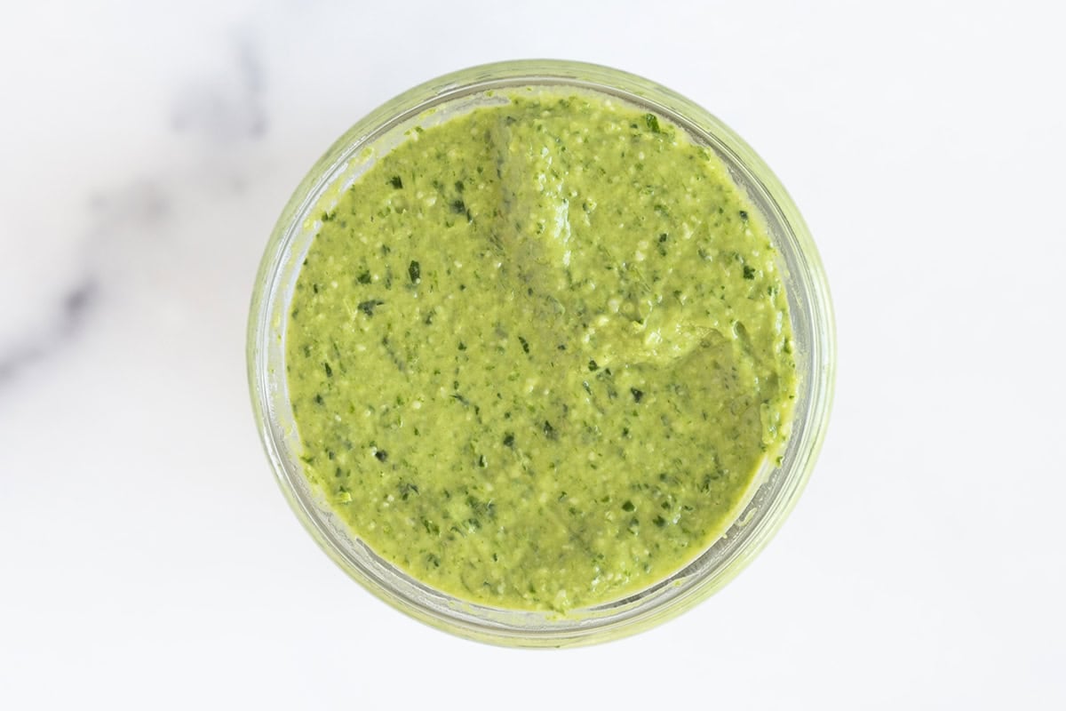 Avocado pesto in glass bowl.