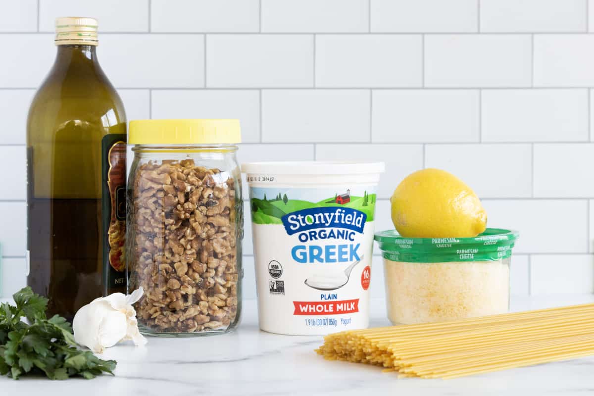 Ingredients for pasta with yogurt sauce on countertop.