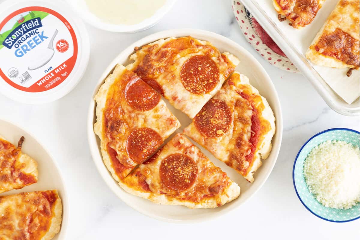 greek yogurt pizza dough pizza on plate with toppings.
