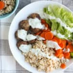 lamb-meatballs-with-rice-and-carrots-in-white-plate