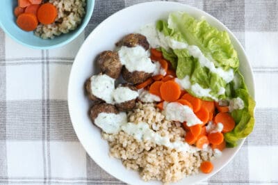lamb-meatballs-with-rice-and-carrots-in-white-plate