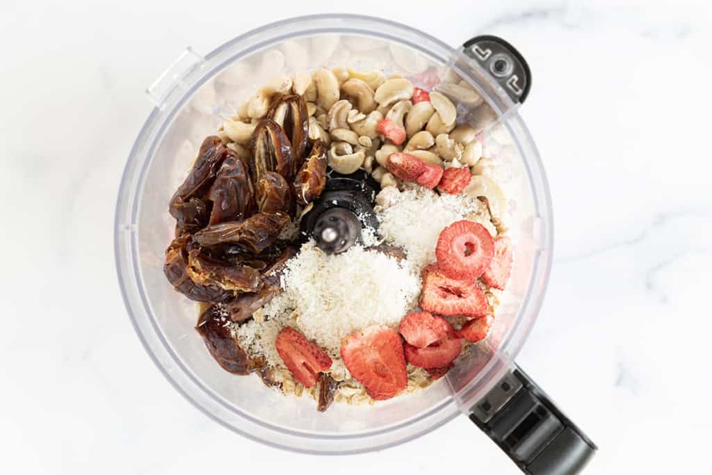 Ingredients for bliss balls in food processor.