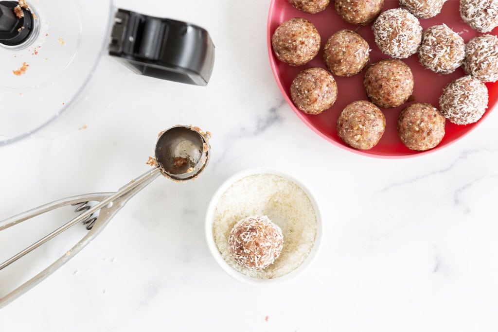 Making bliss balls on red plate.