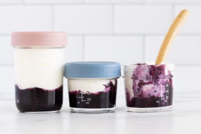 fruit on the bottom blueberry yogurt in small jars.