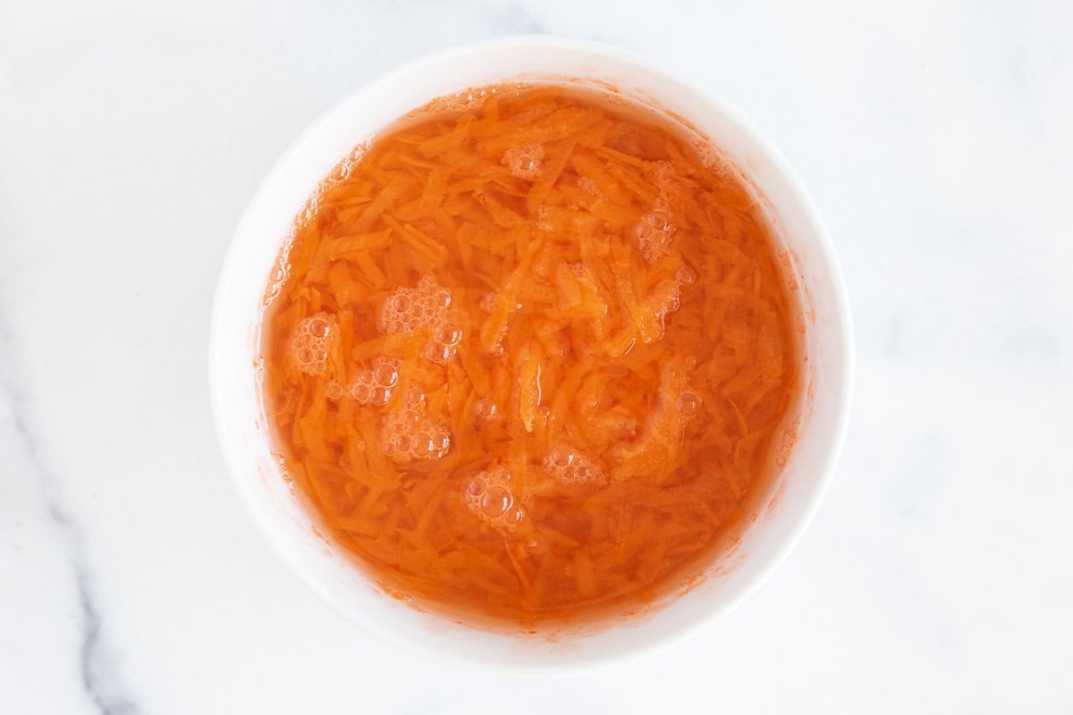 Carrots in water for carrot hummus.