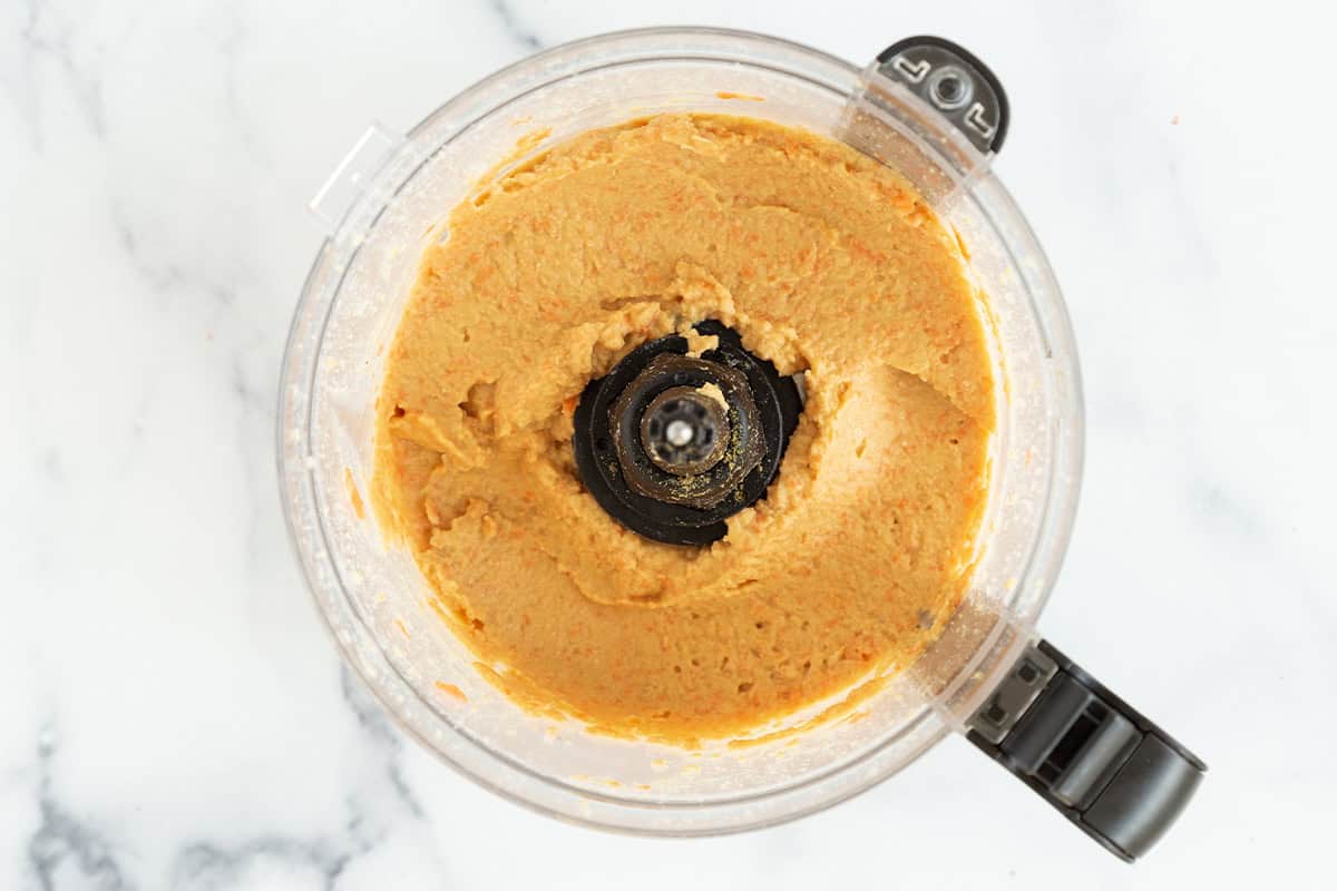 Carrot hummus in food processor.