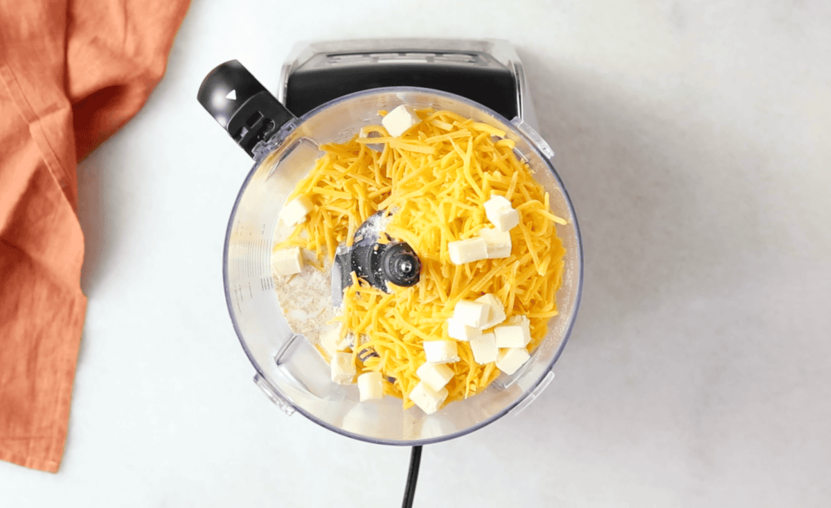 Ingredients for cheese crackers in food processor. 