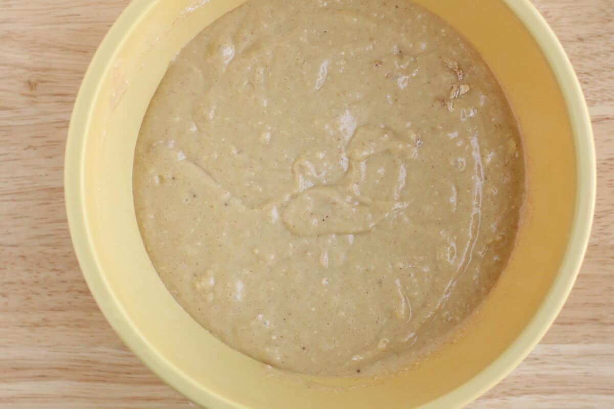 Batter for banana cupcakes in yellow bowl.