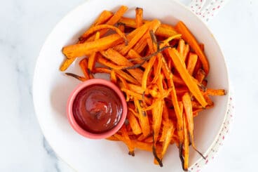 air fryer carrots in white bowl.