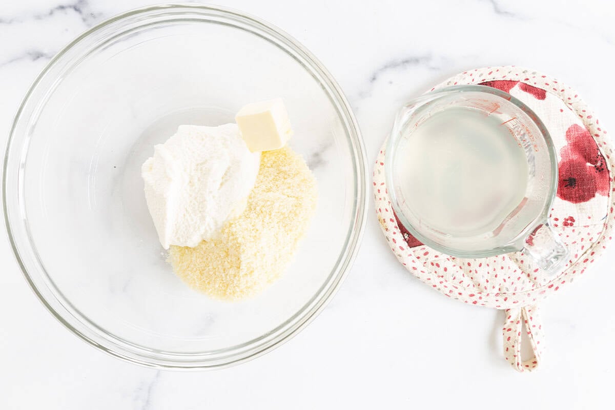 Ingredients for lemon ricotta pasta in two glass bowls.