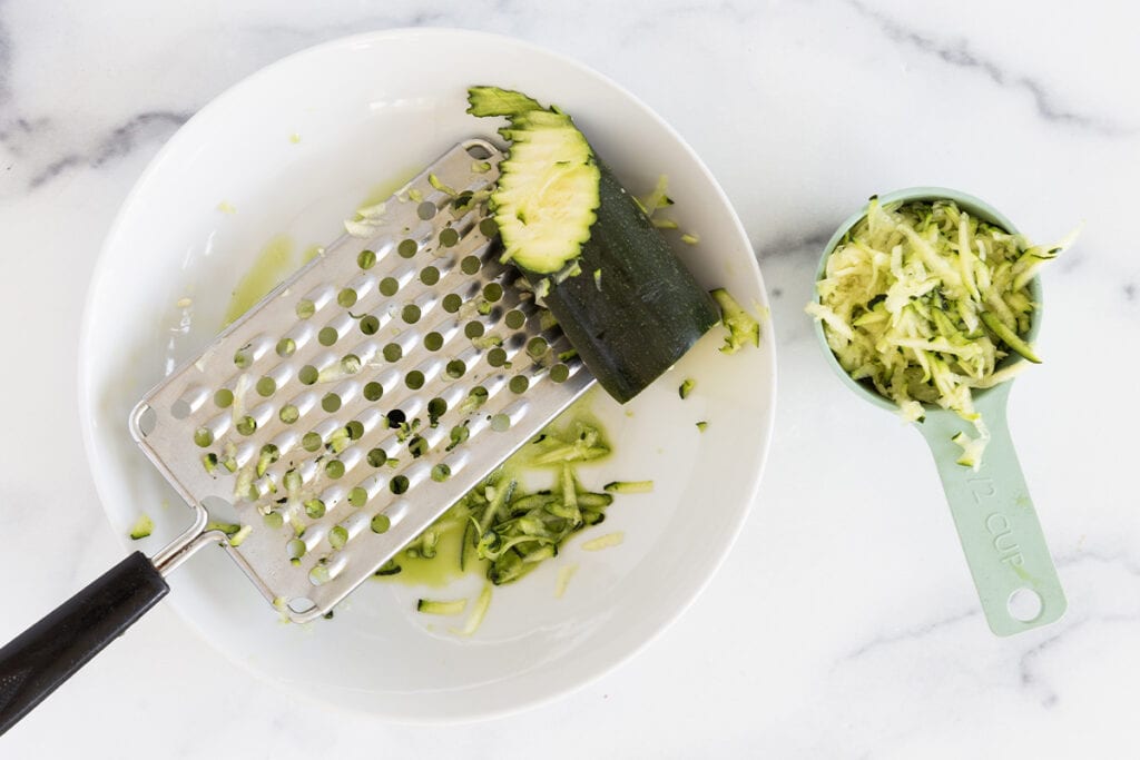 shredded zucchini in bowl.