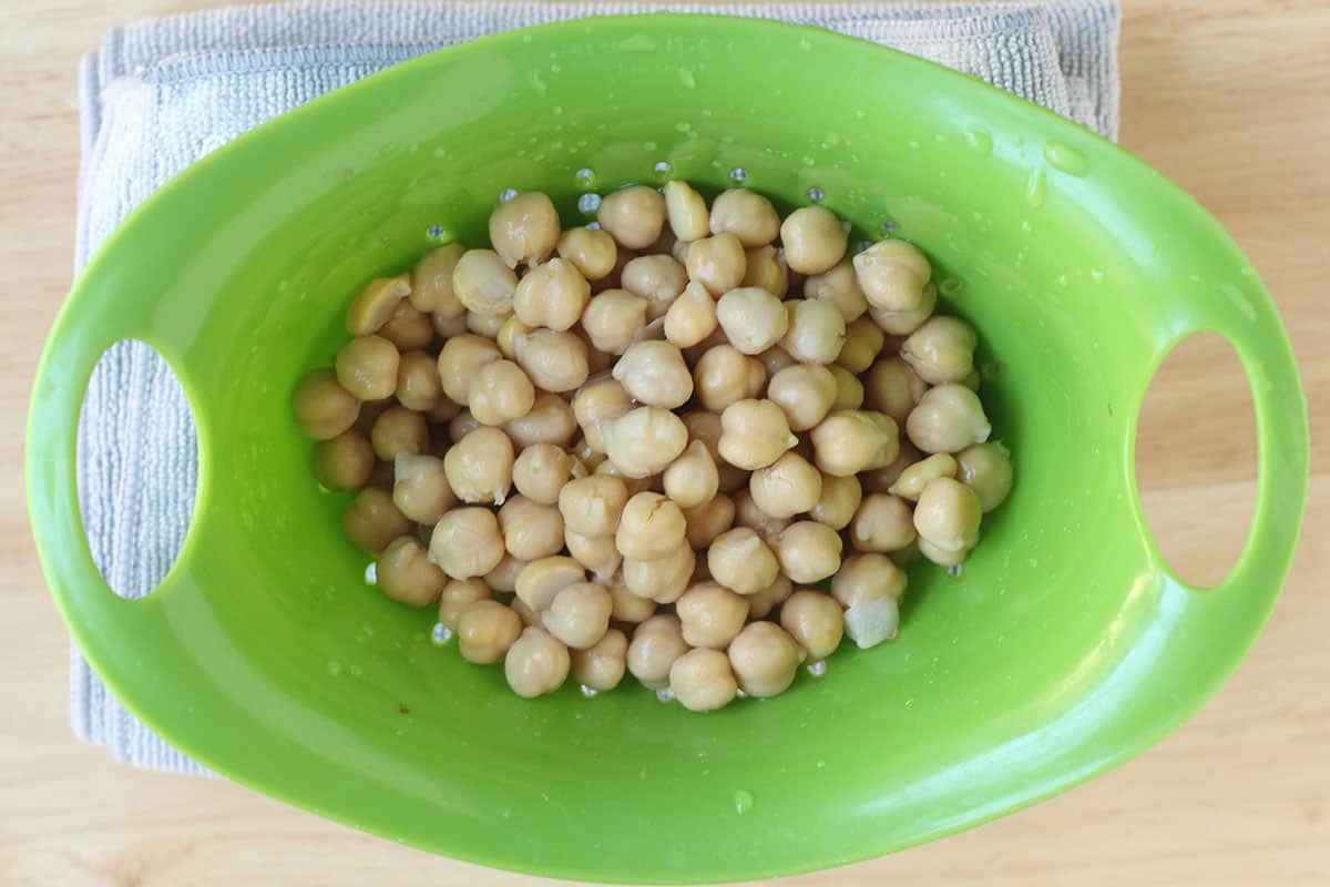 chickpeas in green colander.
