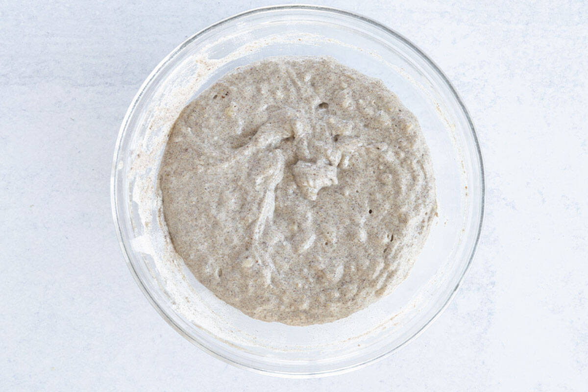 batter for vegan banana pancakes in glass bowl.