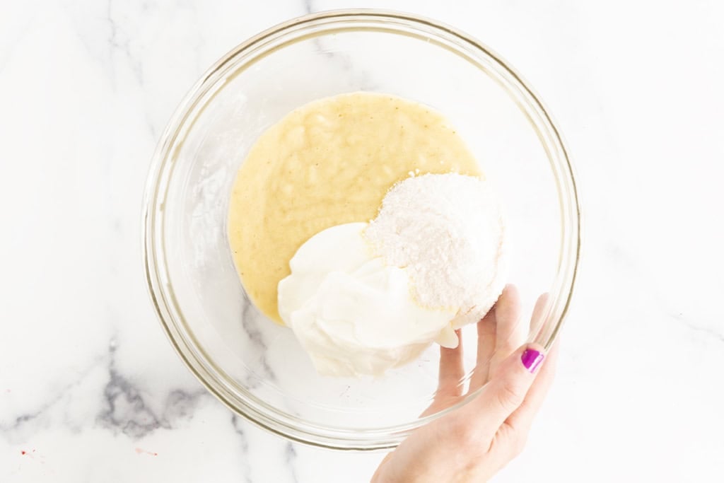 Ingredients for banana pudding in glass bowl before mixing.