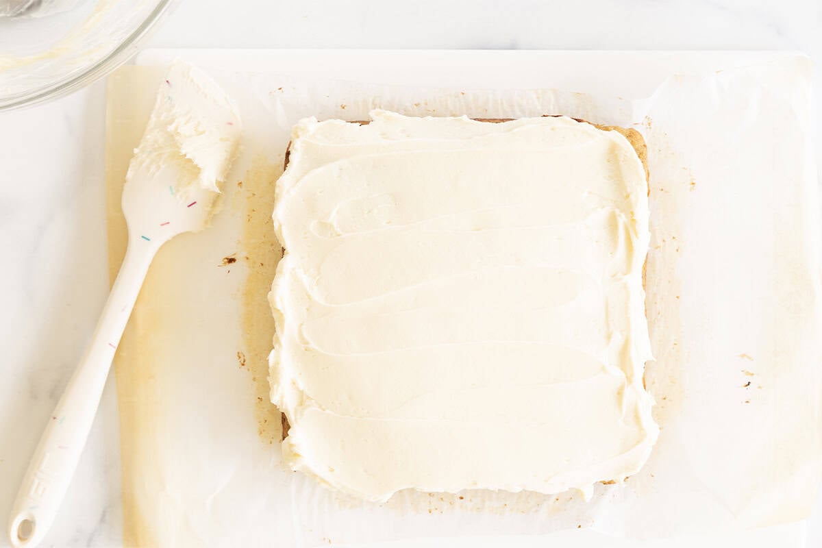 Frosting zucchini cake.