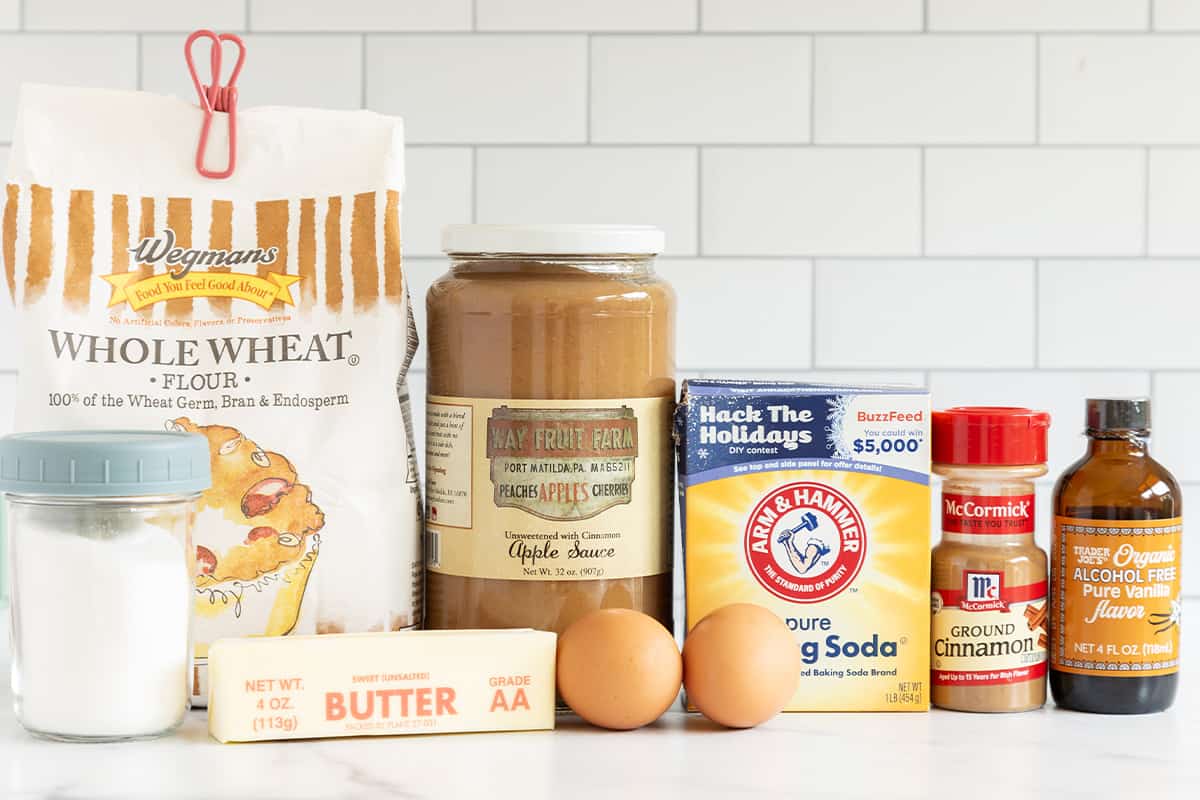 Ingredients for applesauce bread on countertop.