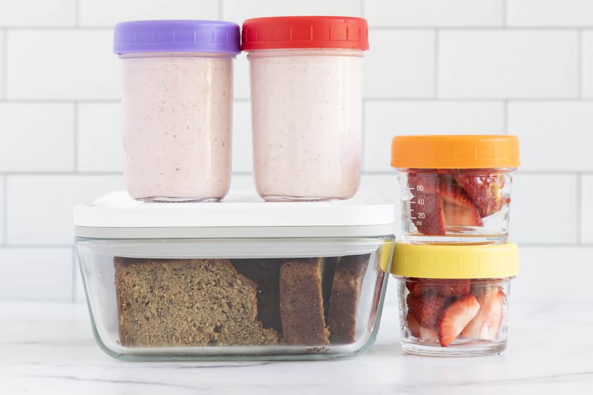 breakfast meal prep containers in stack on counter.