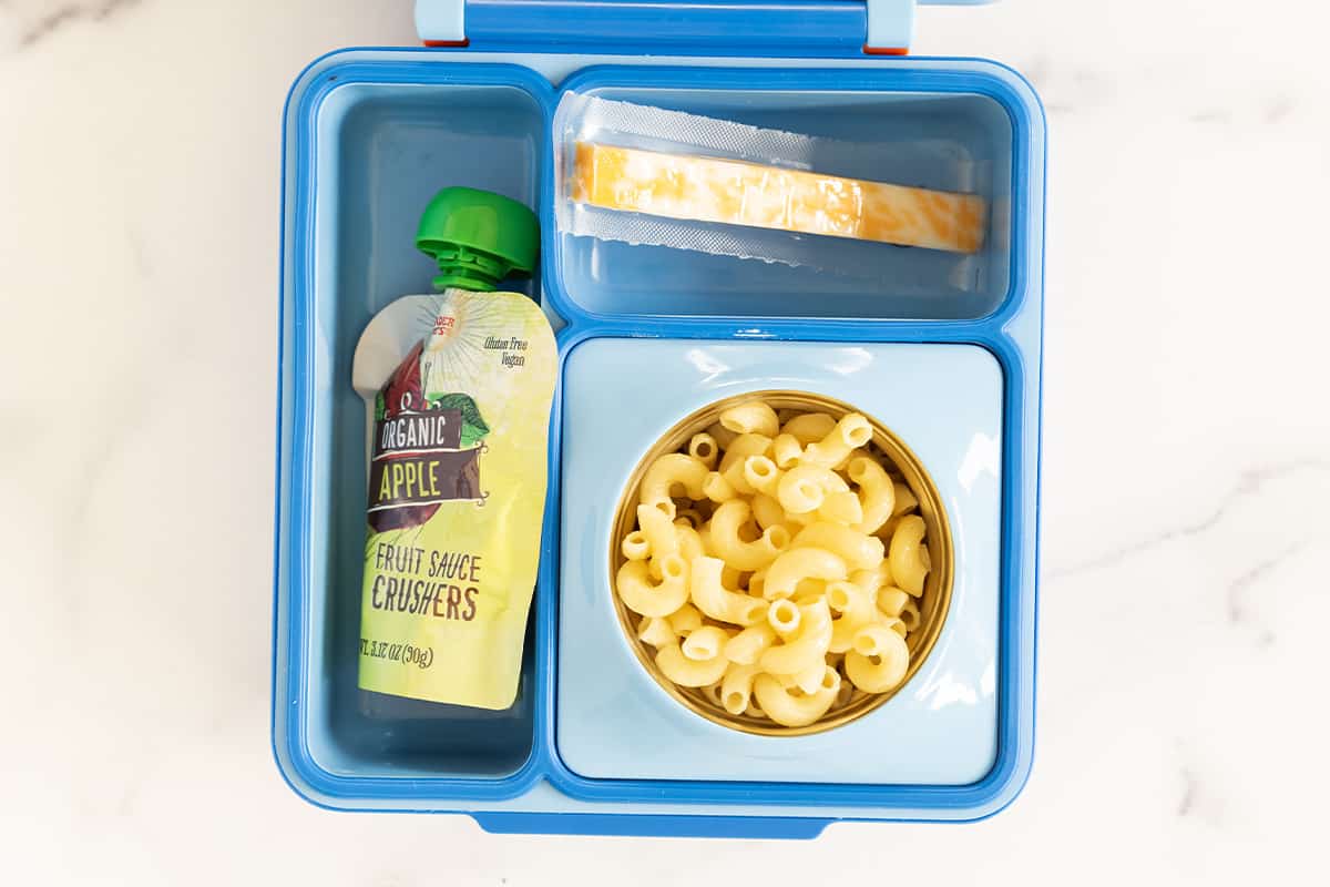 kids lunch with pasta in a blue lunch box.
