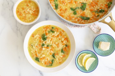 Orzo soup in bowls and pan.