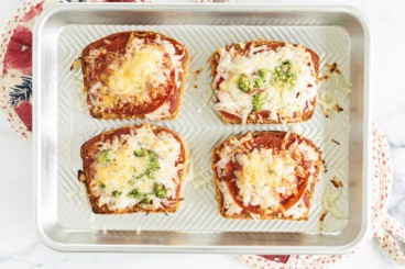 Pizza toast on baking sheet after baking.
