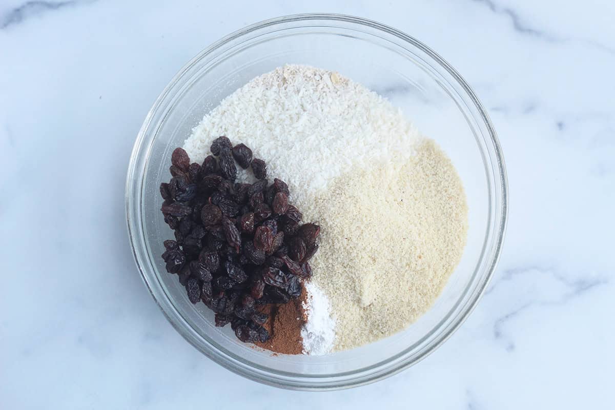 Ingredients for breakfast cookies in glass bowl. 