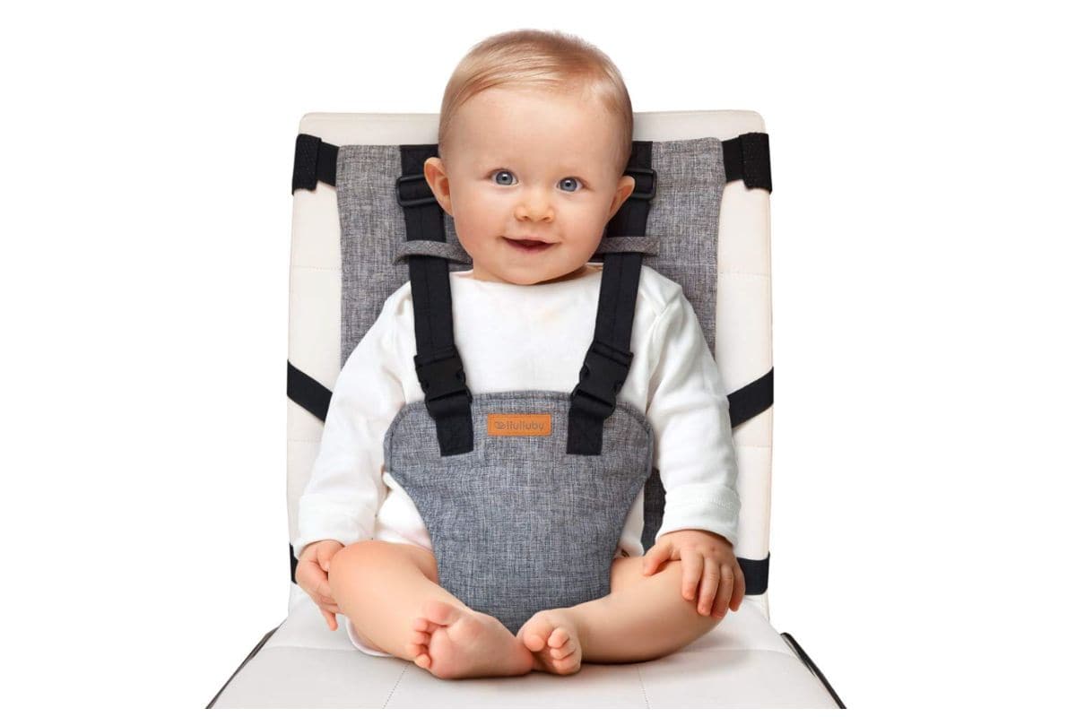 Hullubaby portable highchair with baby in it.